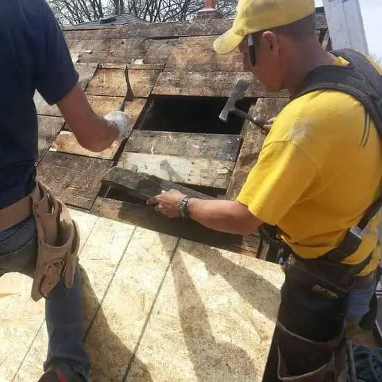 Two Toronto roofers replace rotten roof decking on a steep residential roof&mdash;roof repair and roof replacement, with slate roofing expertise by Right Choice Roofing and Repair.
