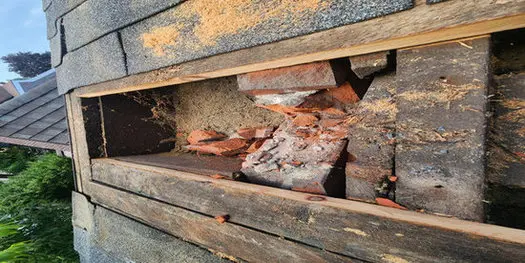 Professional roof repair in Toronto with damaged bricks and roof structure exposed before restoration by Right Choice Roofing and Repair.
