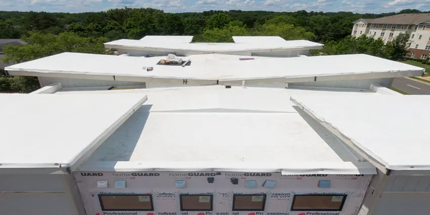 Toronto flat roof replacement project with new white membrane installed by Right Choice Roofing and Repair.