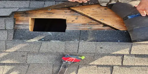 Roof shingles repair in progress on a Toronto home, showing damaged shingles removed and roof decking exposed during professional roof repair.