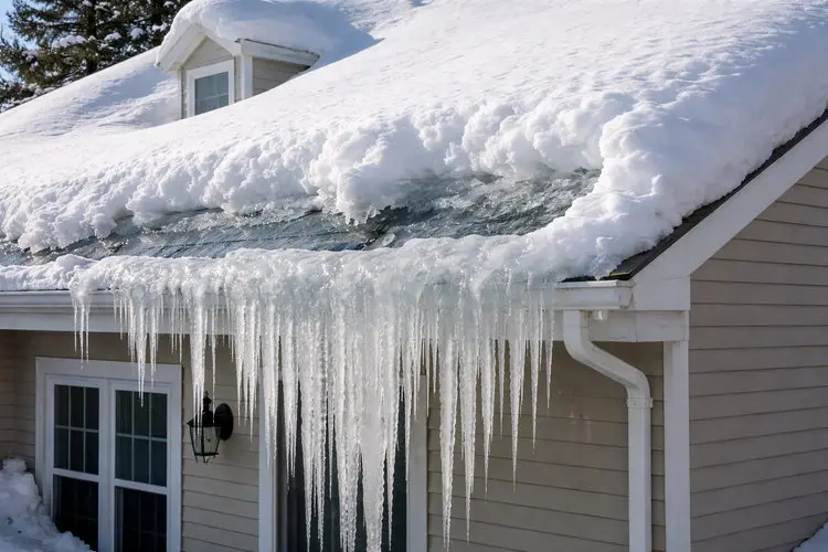 Severe ice dam formation with dangerous icicles and heavy snow buildup on Toronto residential roof requiring emergency removal by Right Choice Roofing and Repair