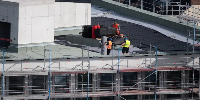 Commercial flat roof replacement in progress on a Toronto building