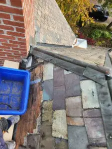150-year-old original natural Slate Roof tiles in Rosedale Toronto showing a heritage colour blend of Unfading Black, Gray, Green, Purple, and Semi-Weathering shades exposed during replacement by Right Choice Roofing and Repair