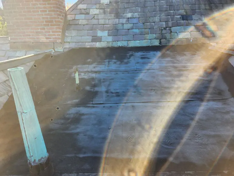 Before photo of a worn flat Roof section and aging Slate Roof in Rosedale Toronto prior to replacement by Right Choice Roofing and Repair