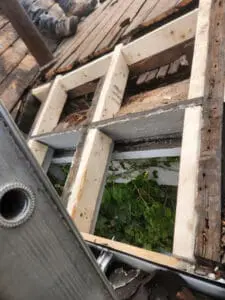 Custom Roof carpentry in progress on a Rosedale Toronto heritage home with new framing lumber replacing rotted Roof edge structure at the Eavestrough
