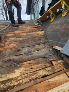 Extreme water leak damage and rotted wood substrate boards uncovered during a Toronto slate roof restoration by Right Choice Roofing and Repair.