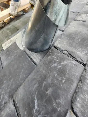 Completed plumbing exhaust flange and slate tile replacement on a Toronto heritage roof by Right Choice Roofing and Repair