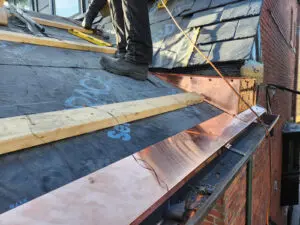 Professional slate roof restoration and copper flashing installation in Toronto by Right Choice Roofing and Repair.