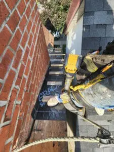 Progress photo showing 2x4 fall barrier step ups installed on steep slate roof to provide safe standing access during slate roof replacement in Harbord Village Toronto by Right Choice Roofing and Repair