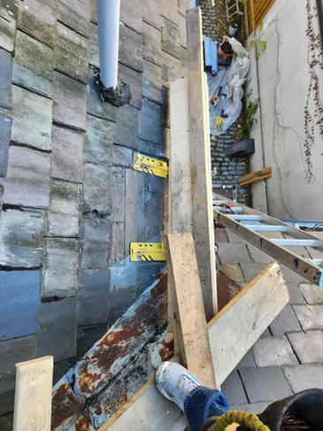 Engineered work platform for safe slate roof access for slate roof repair in Toronto.