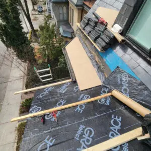 Comprehensive slate roofing project in Toronto by Right Choice Roofing and Repair, showing underlayment installation and staged slate tiles.