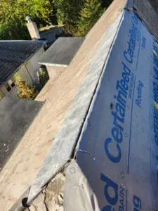 Completed natural Slate tiles on the opposite side of the main sloped Roof Ridge with CertainTeed DiamondDeck underlayment installed on the near side ready for new Slate on a Rosedale Toronto heritage home by Right Choice Roofing and Repair