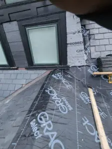 Right Choice Roofing and Repair installing high-performance Grace Select vapor barrier over new plywood on a Toronto slate roof.