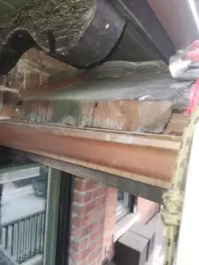 Exposed soffit bulkhead with evidence of wildlife infestation on a Toronto residential property, inspected by Right Choice Roofing and Repair.