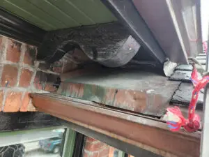Alternative Text: Squirrel infestation and structural gaps in a Toronto home's soffit and bulkhead, inspected by Right Choice Roofing and Repair.