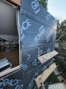 Progress photo showing Grace Select underlayment fully installed on steep dormer slate roof with 2x4 work platforms in place for safe access in Harbord Village Toronto by Right Choice Roofing and Repair