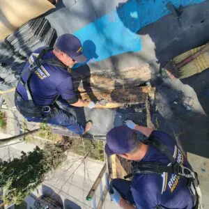 Right Choice Roofing and Repair specialists fixing a leaking slate and flat roof in Toronto by replacing damaged substrate boards.