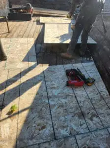 New OSB plywood installation in progress on a Rosedale Toronto heritage Roof with cordless nail gun and fresh decking being fastened by Right Choice Roofing and Repair