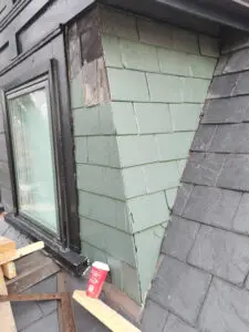 Wildlife damage on a Toronto slate dormer wall inspected by Right Choice Roofing and Repair.