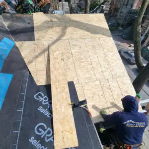Professional wood carpentry repair for a slate roof in Toronto by Right Choice Roofing and Repair, showing new roof deck installation.