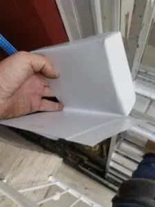 Expert metal Flashing fabrication being fitted over new Fascia corner in Bloor West Village, Toronto by Right Choice Roofing and Repair