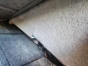 Metal closure piece installed at a Soffit penetration during multi-layer wildlife repair in Toronto