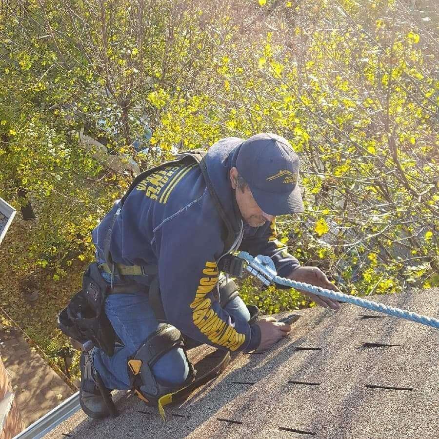 roofer repairing shingles